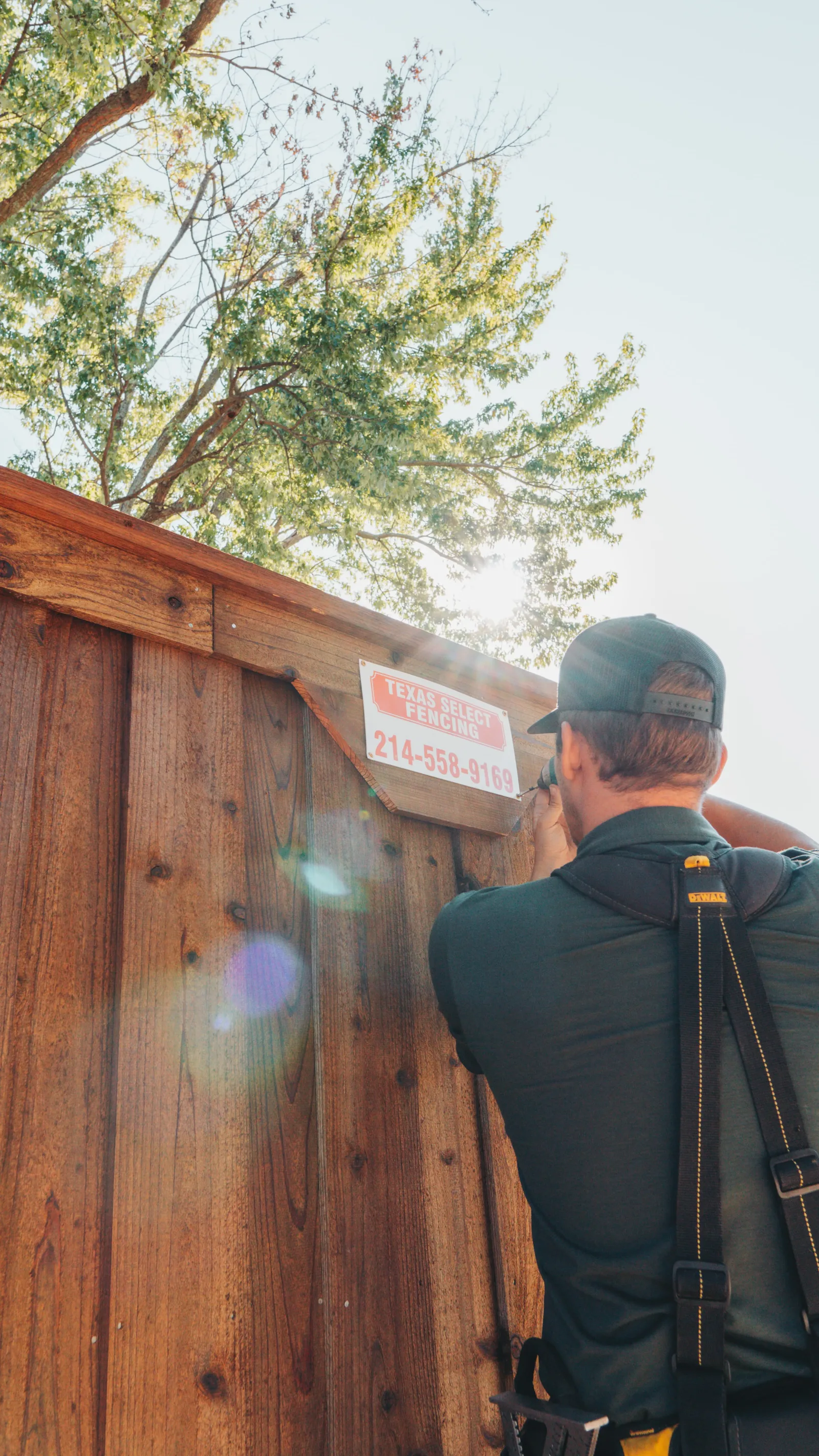 Dylan Snider with Texas Select Fencing sign